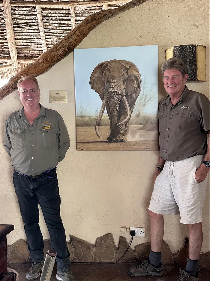 General Manager Graeme Smith receives the canvas Tusker Tim from Simon