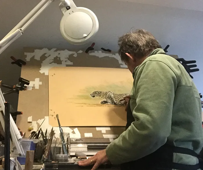 Simon working on a leopard titled 'Stalking' whilst at his studio